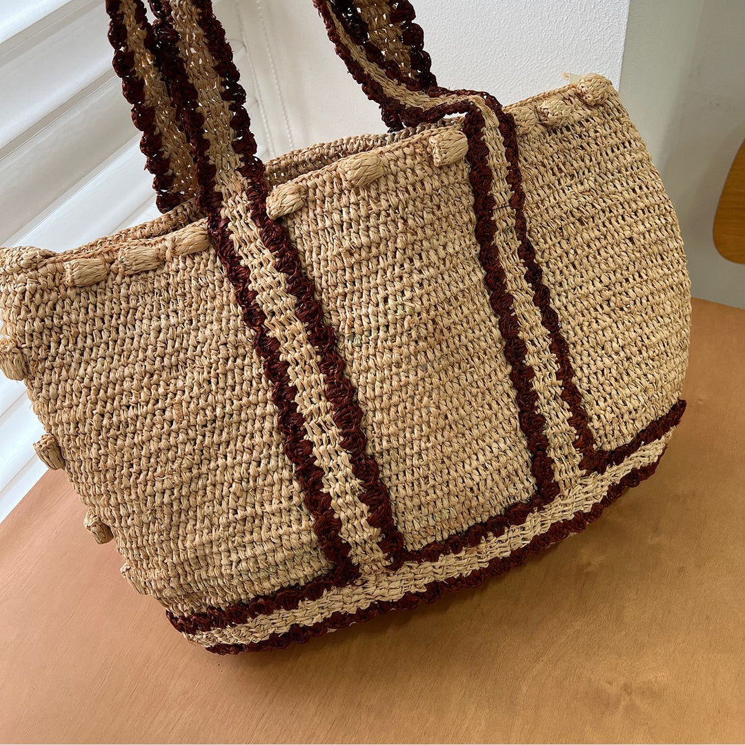 Braided shoulder bag with floral motif Bowlift