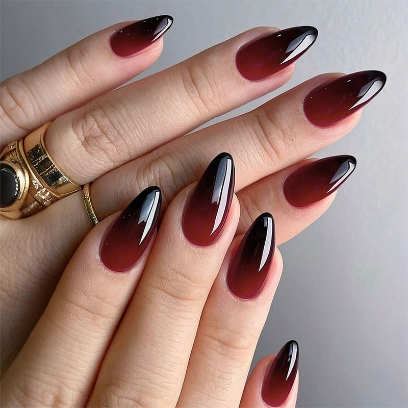 Acrylic nail set with luxurious color gradient and elegant lace accent Bowlift