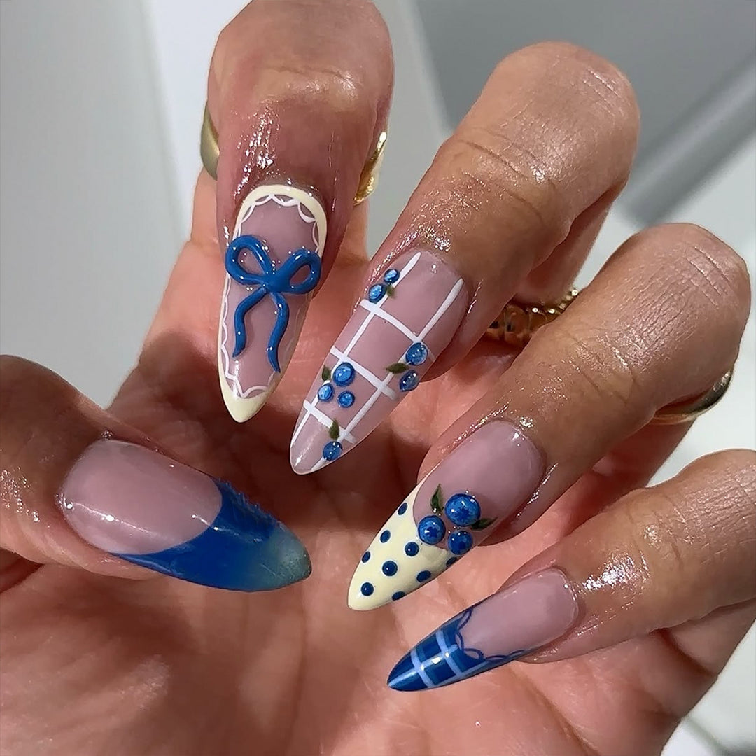 Artificial nails with playful design and elegant accents Bowlift