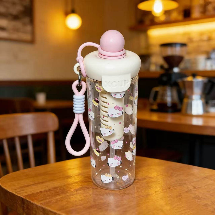 Women's water bottle with cheerful design and practical carrying handle Bowlift