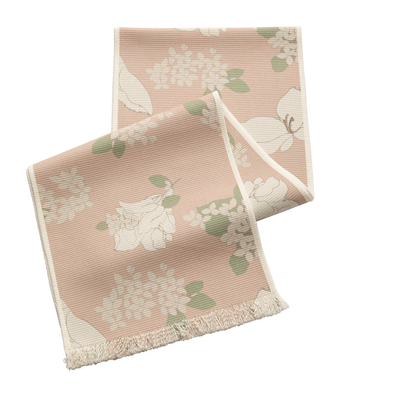 Woven table runner with floral jacquard pattern and fringed edge Bowlift