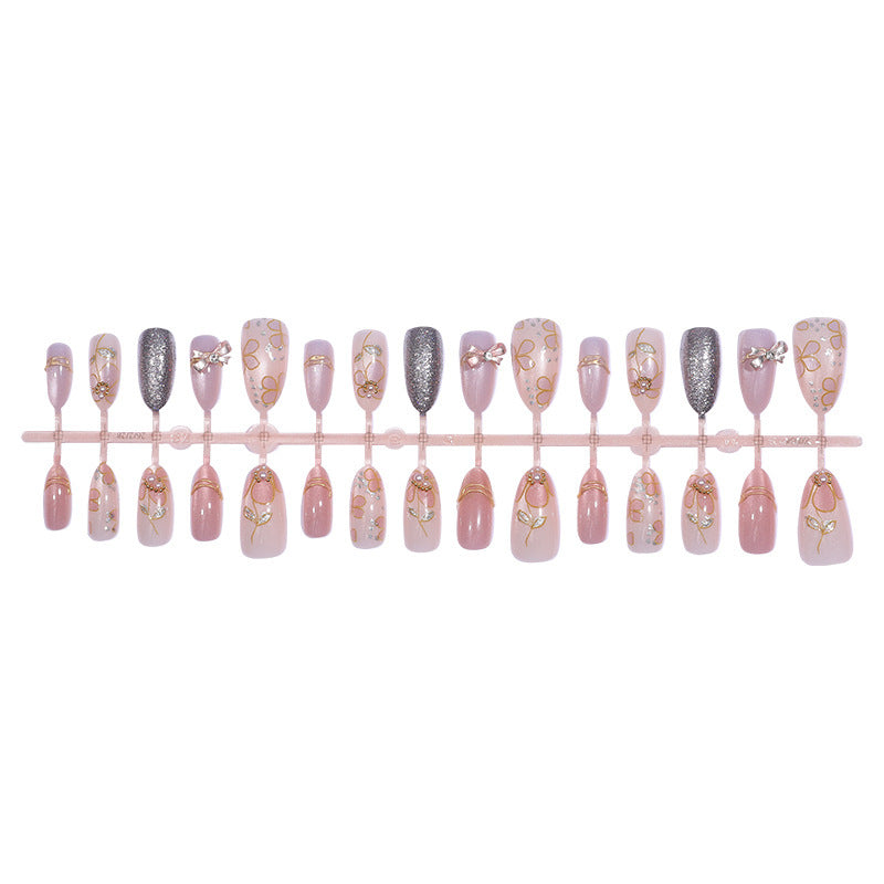 Artificial nail set with decorative flower and glitter embellishments Bowlift