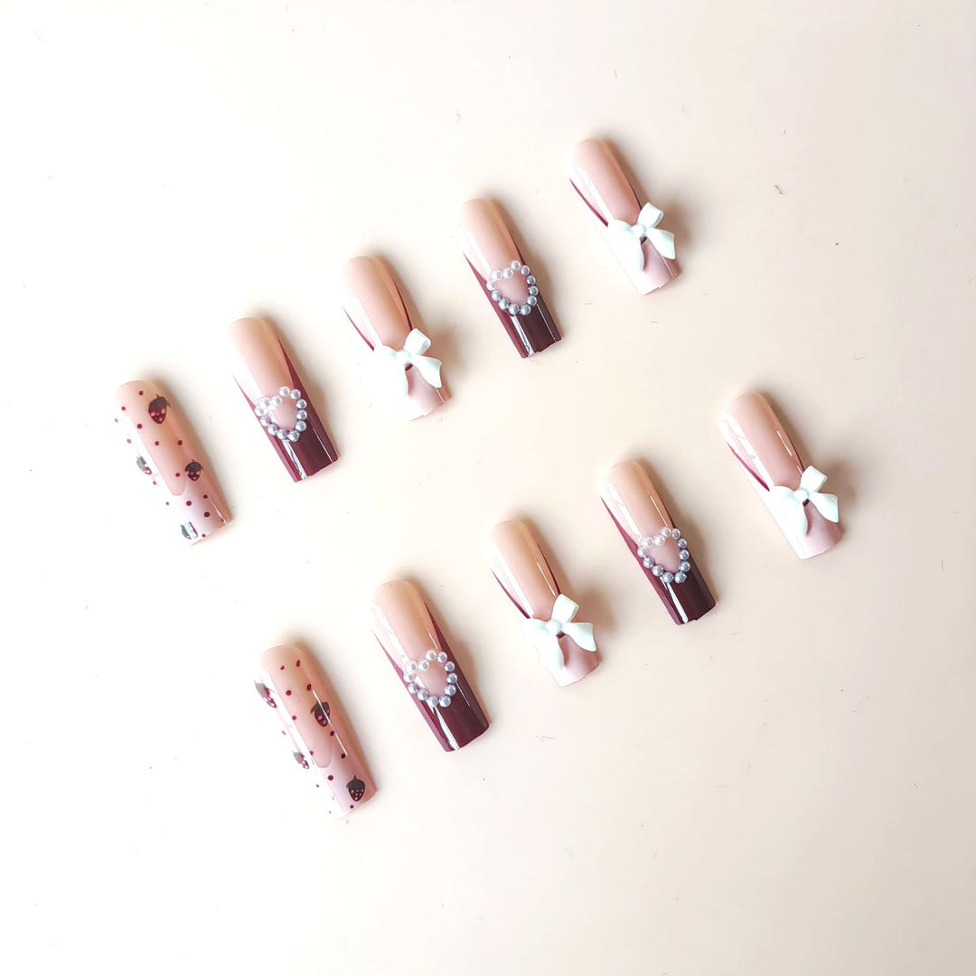 Artificial artificial nails with heart designs and holographic accents Bowlift