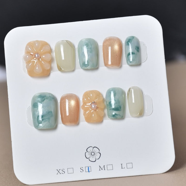 Elegant Nail Art Extensions with Pearl Accents Bowlift