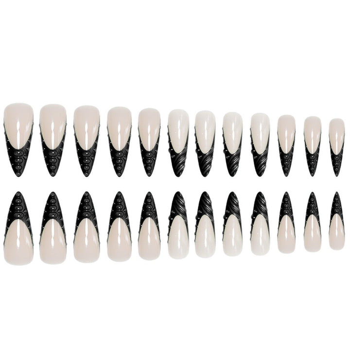 Artistic Stiletto Nail Extensions with Textured Detailing Bowlift