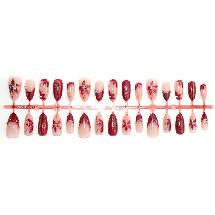 Glamorous artificial nail set with elegant floral and glitter details Bowlift