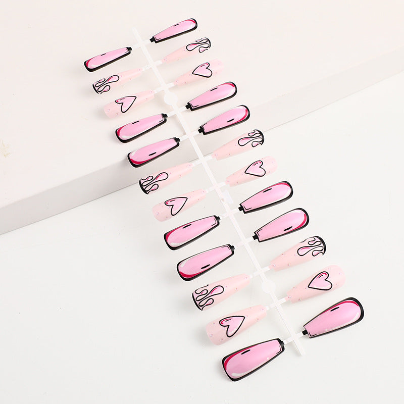 Eye-catching artificial nails with soulful heart design and glamorous accents Bowlift