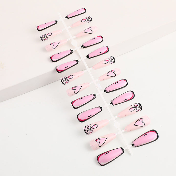 Eye-catching artificial nails with soulful heart design and glamorous accents Bowlift