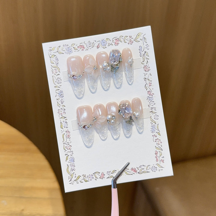 Artificial nails with delicate glitter and pearl decoration Bowlift