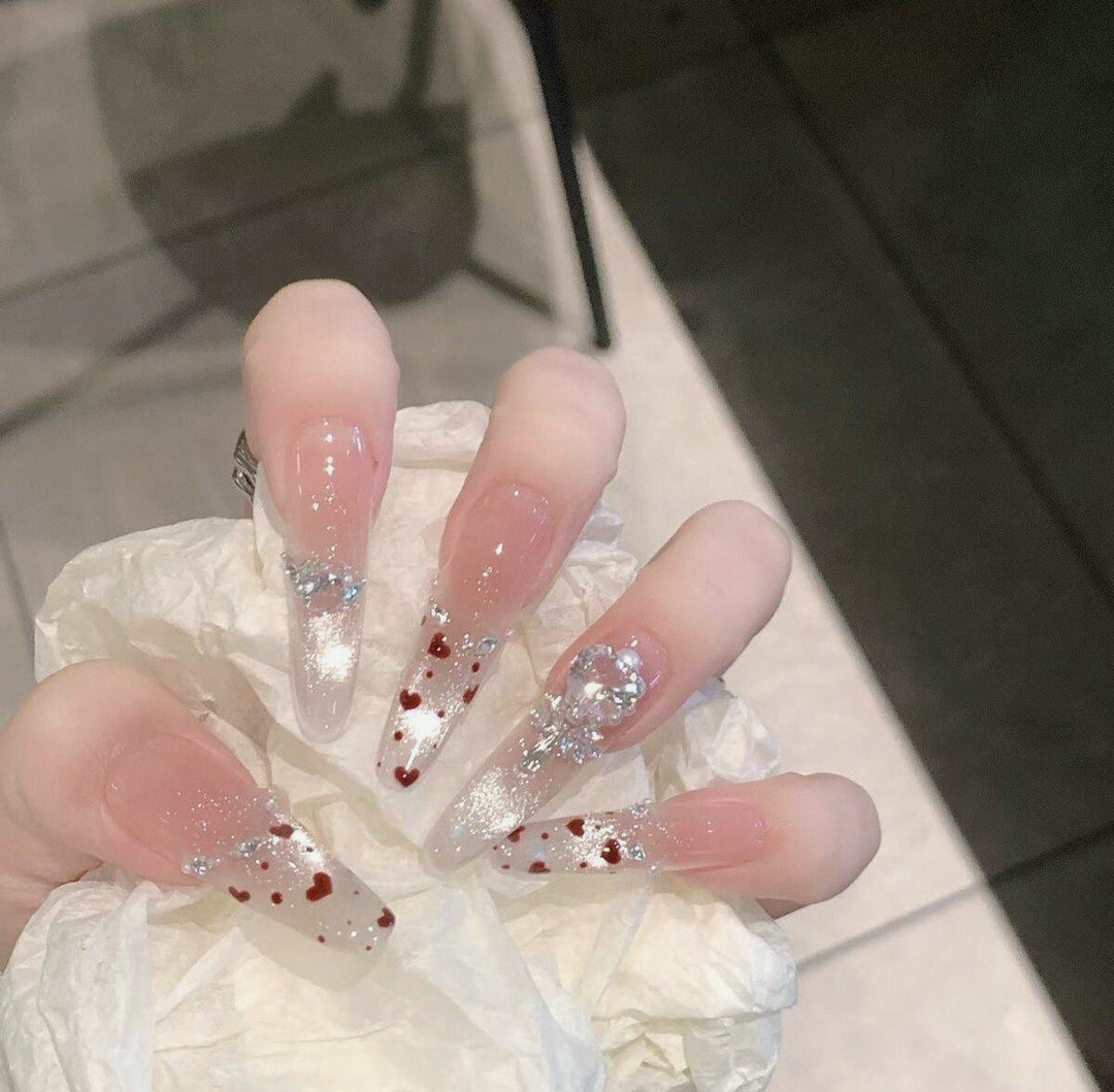 Artistic Stiletto Press-On Nail Art with Glimmering Accents Bowlift