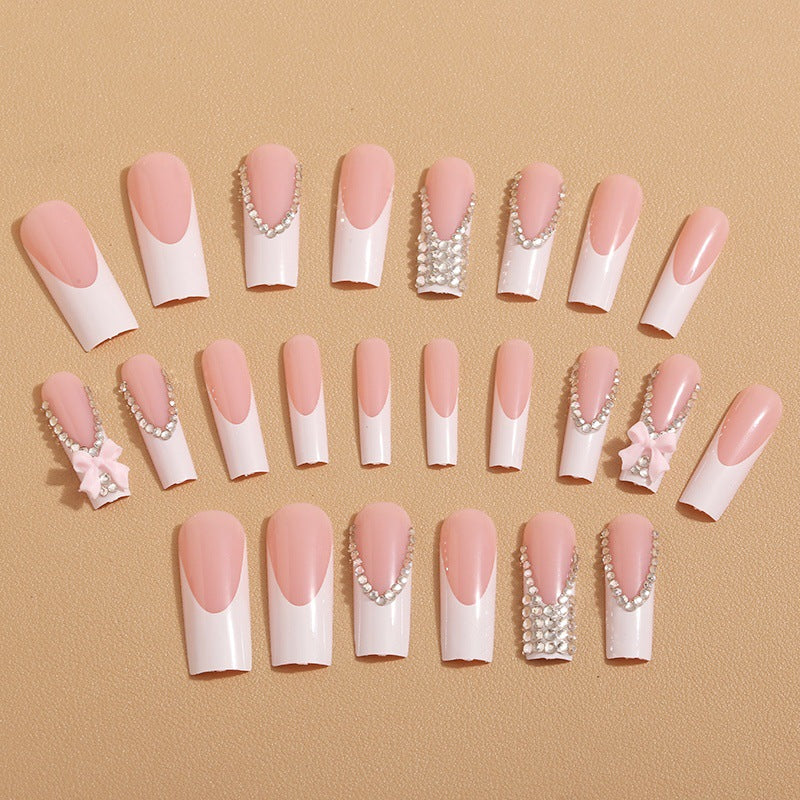 Artificial nails with glamorous rhinestone decorations and floral accents Bowlift
