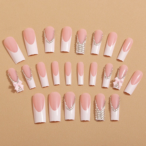 Artificial nails with glamorous rhinestone decorations and floral accents Bowlift