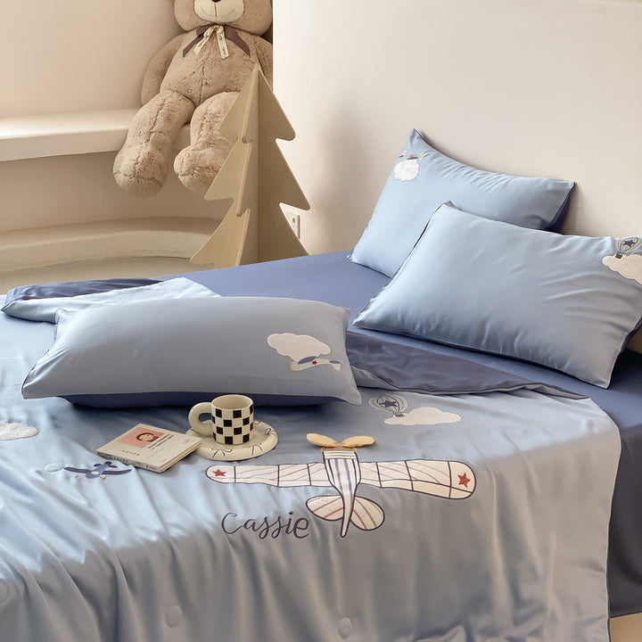 Satin bedding set with embroidered airplane design