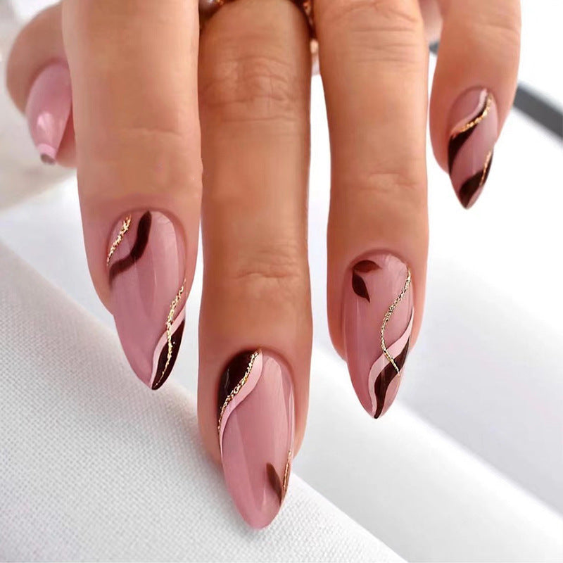 Artistic Nail Decoration with Gold Accents Bowlift