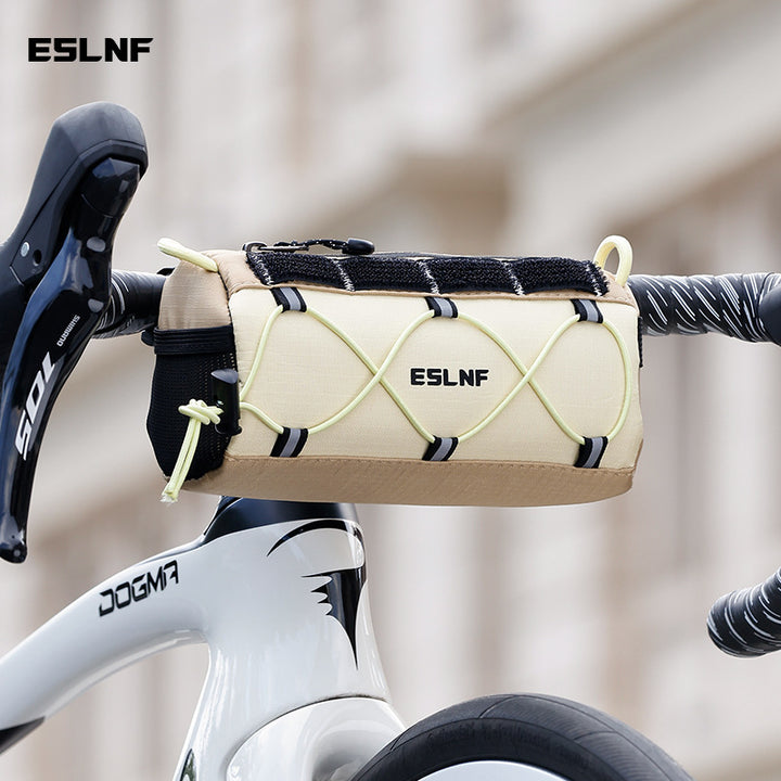 compact cylindrical handlebar bag with elastic bungee and universal Velcro mount Bowlift