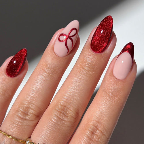 Artificial nail set with elegant red and delicate bow accents Bowlift
