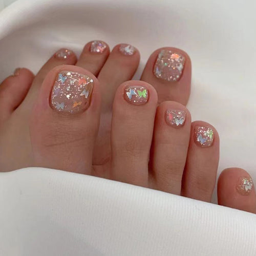Artful toenail art with glitter and butterfly designs Bowlift
