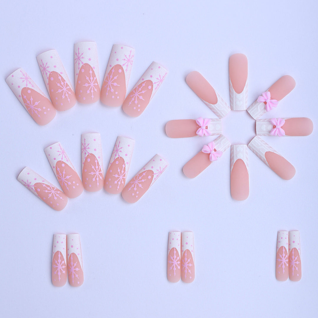 Artificial nail tips with playful bows and snowflake design Bowlift