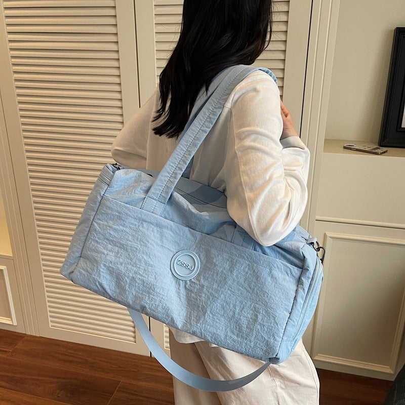 Sporty travel bag with practical exterior pockets Bowlift