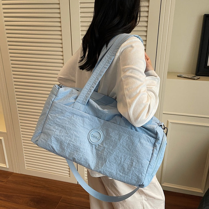 Sporty travel bag with practical exterior pockets Bowlift