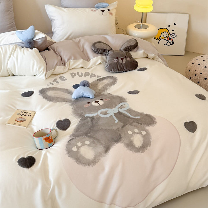 Children's bedding set with large rabbit motif, plush appliqué and pom-pom corners