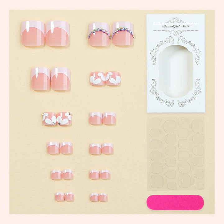 Creative nail art set with elegant flower designs and glitter accents Bowlift