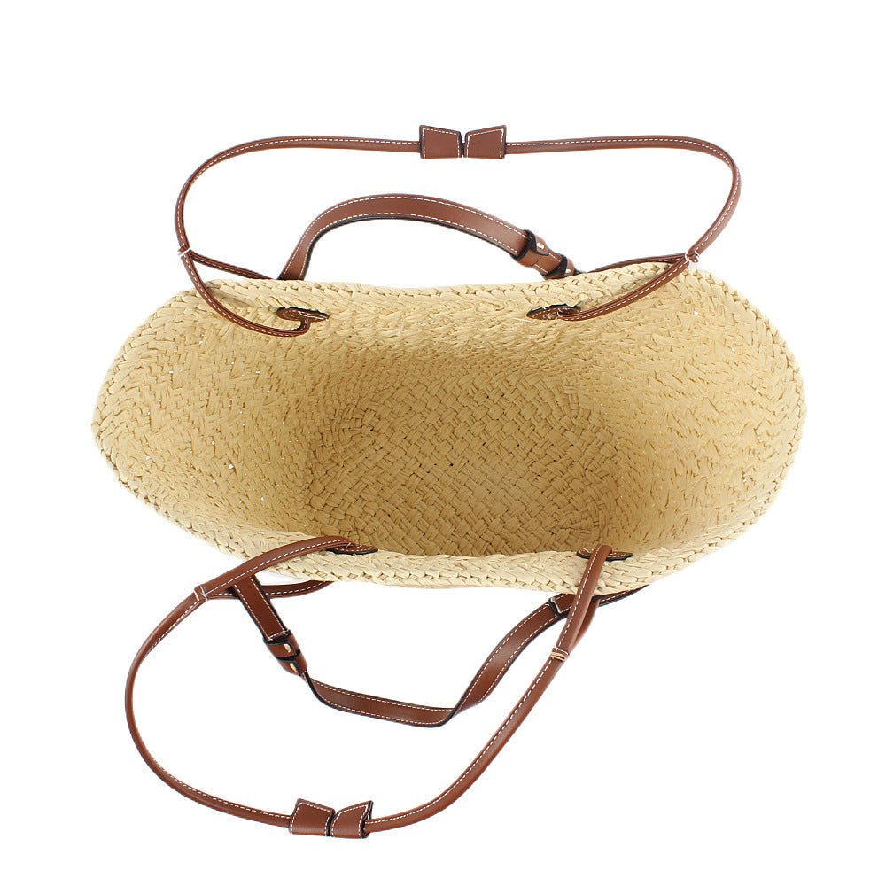 Elegant handbag made of woven natural material with sturdy leather handles Bowlift
