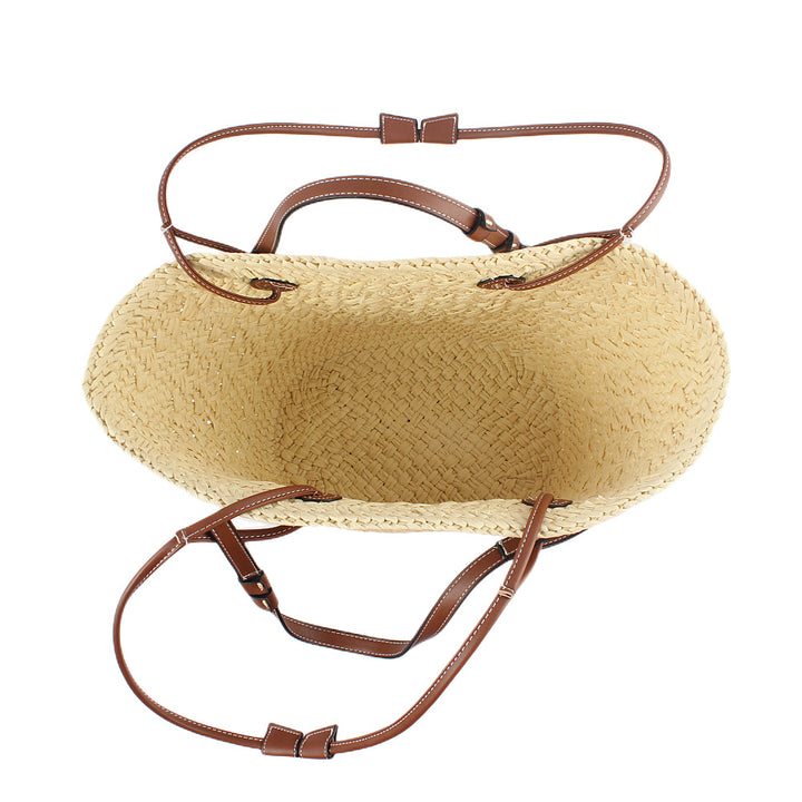 Elegant handbag made of woven natural material with sturdy leather handles Bowlift