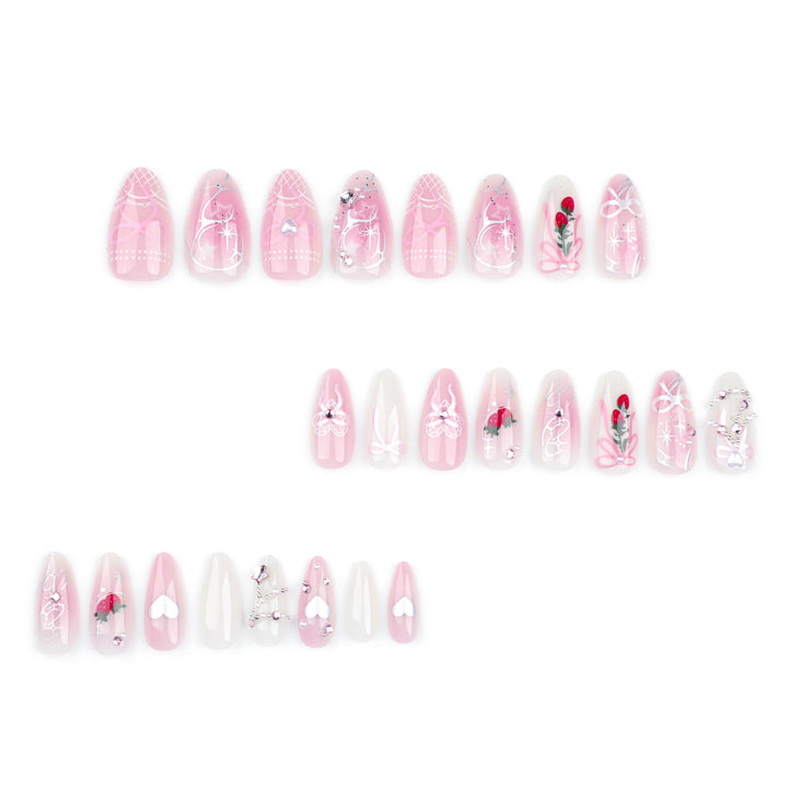 Artificial nail art with romantic design and glitter accents Bowlift