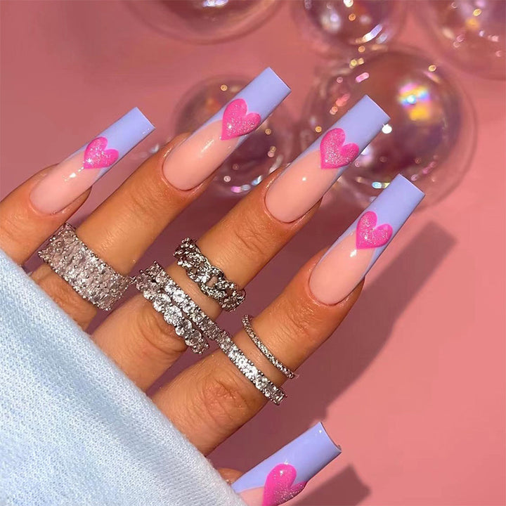 Artful stiletto nails with colorful heart designs Bowlift