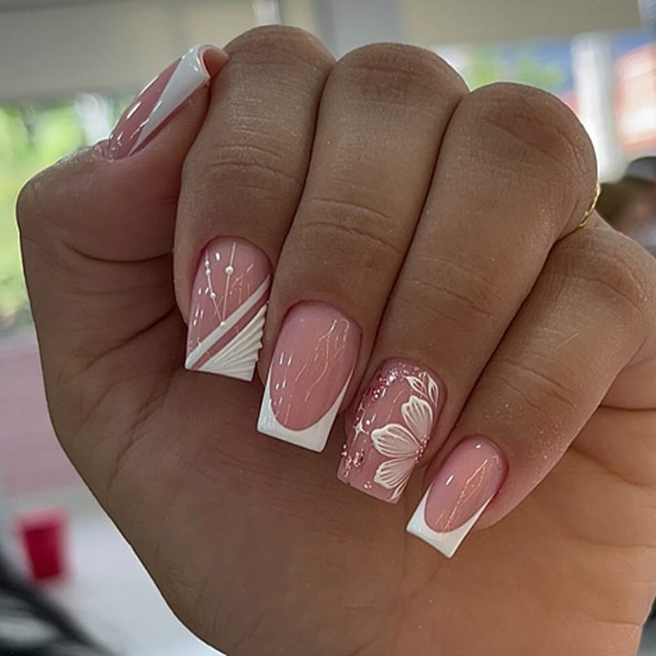 Artful Nail Art with Elegant French Tips and Floral Accents Bowlift