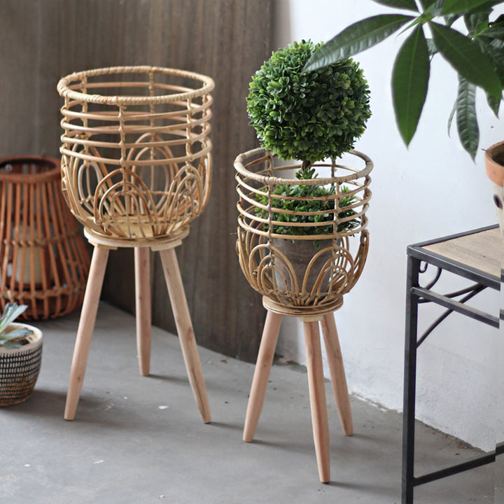Stylish plant stand made of rattan and wood Bowlift