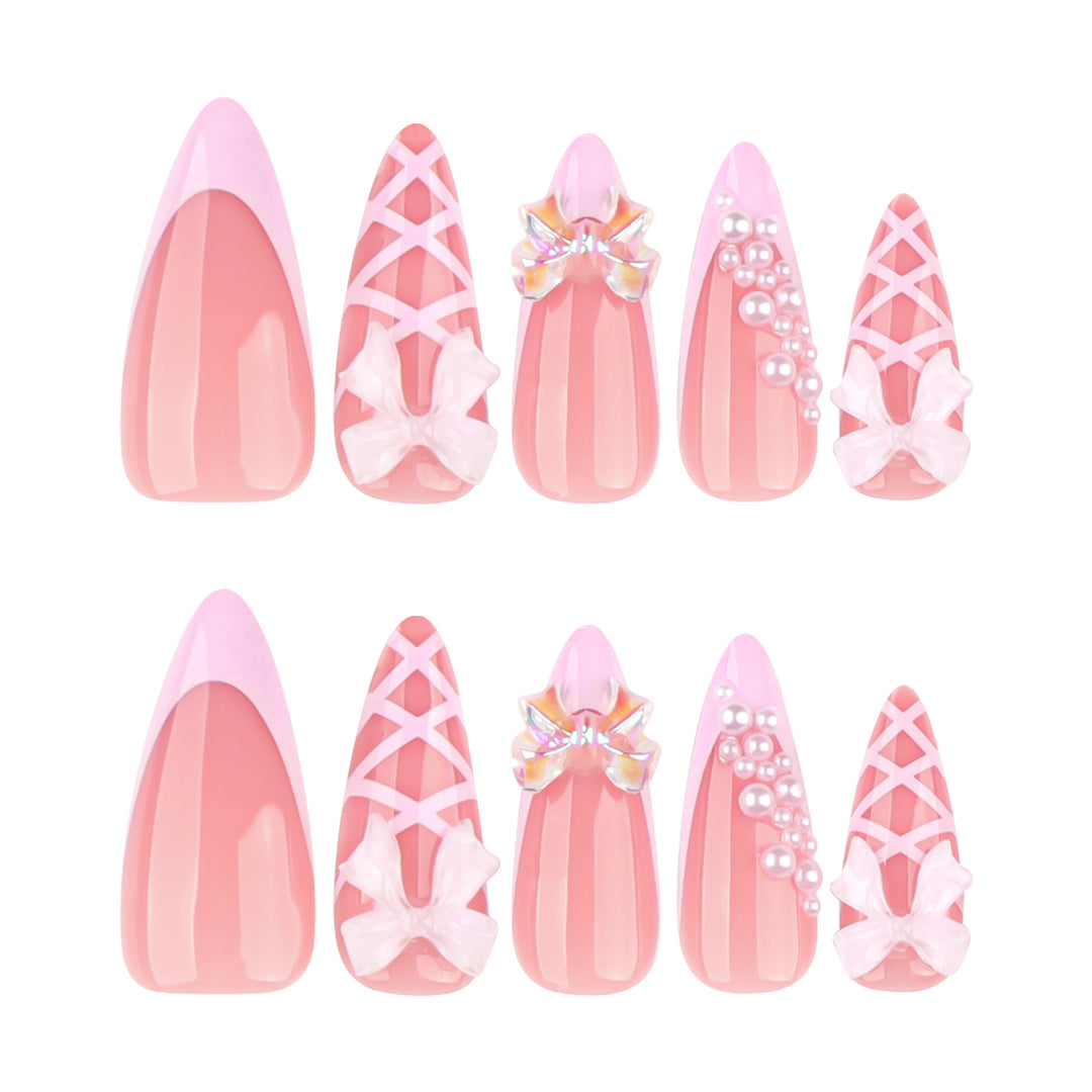 Artful stiletto nails with glitter and bow decoration Bowlift