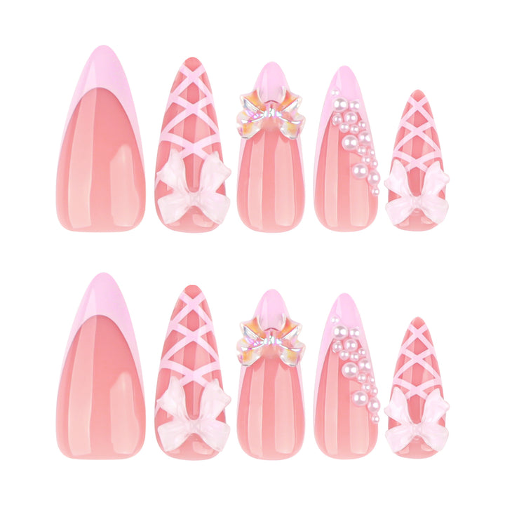 Artful stiletto nails with glitter and bow decoration Bowlift