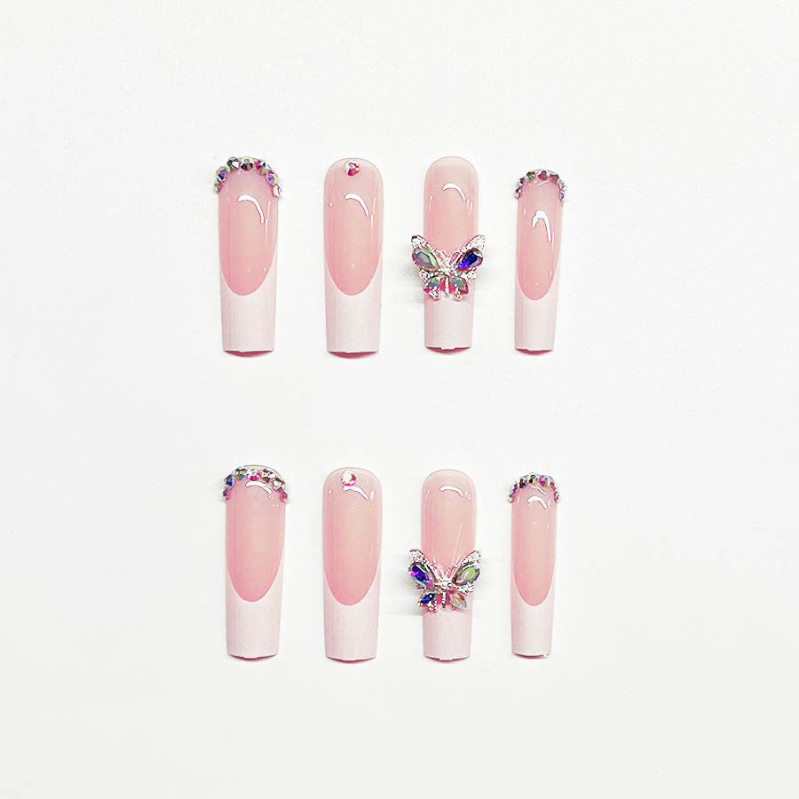 Acrylic nail set with elegant design and sparkling rhinestone accents Bowlift