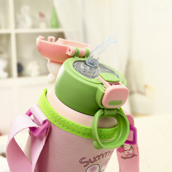 Ladies insulated bottle with integrated drinking mechanism and practical carrying strap Bowlift