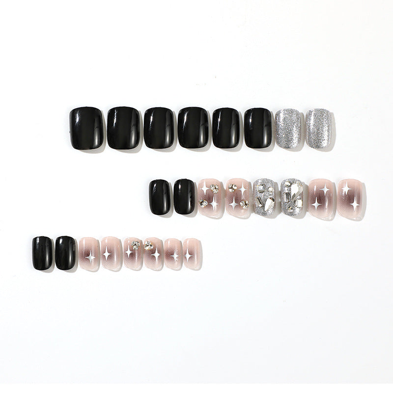 Elegant Nail Art with Glitter and Star Motifs Bowlift