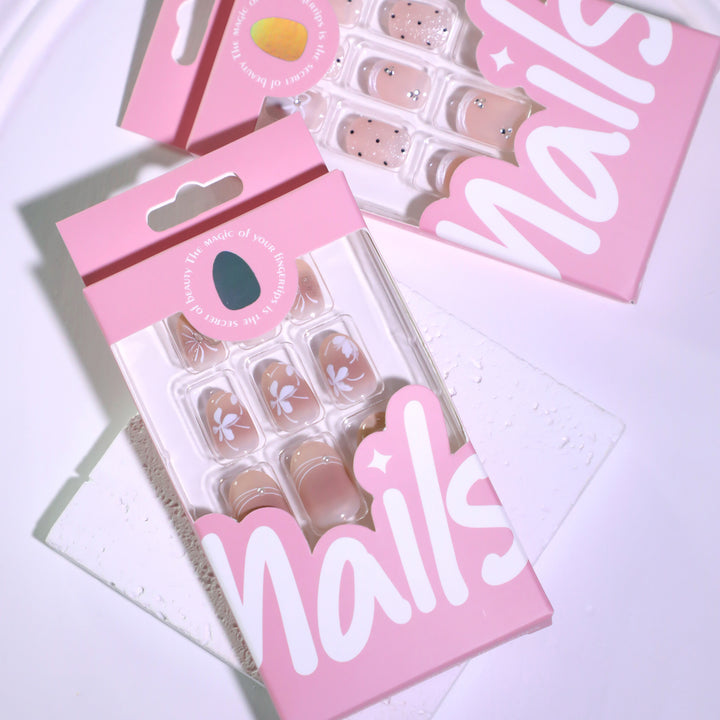 Artful nail design with floral pattern and glitter accents Bowlift