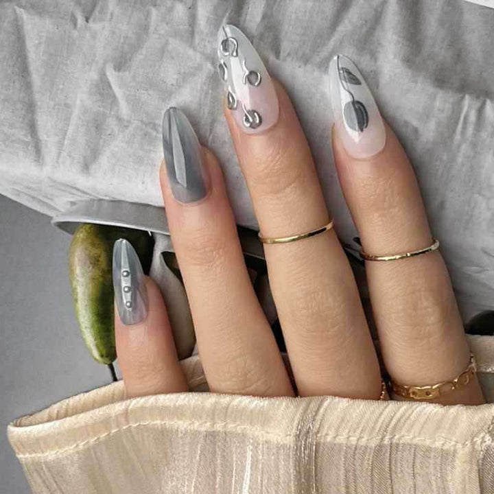 Artistic Stiletto Press-On Nail Design with Contemporary Accents Bowlift