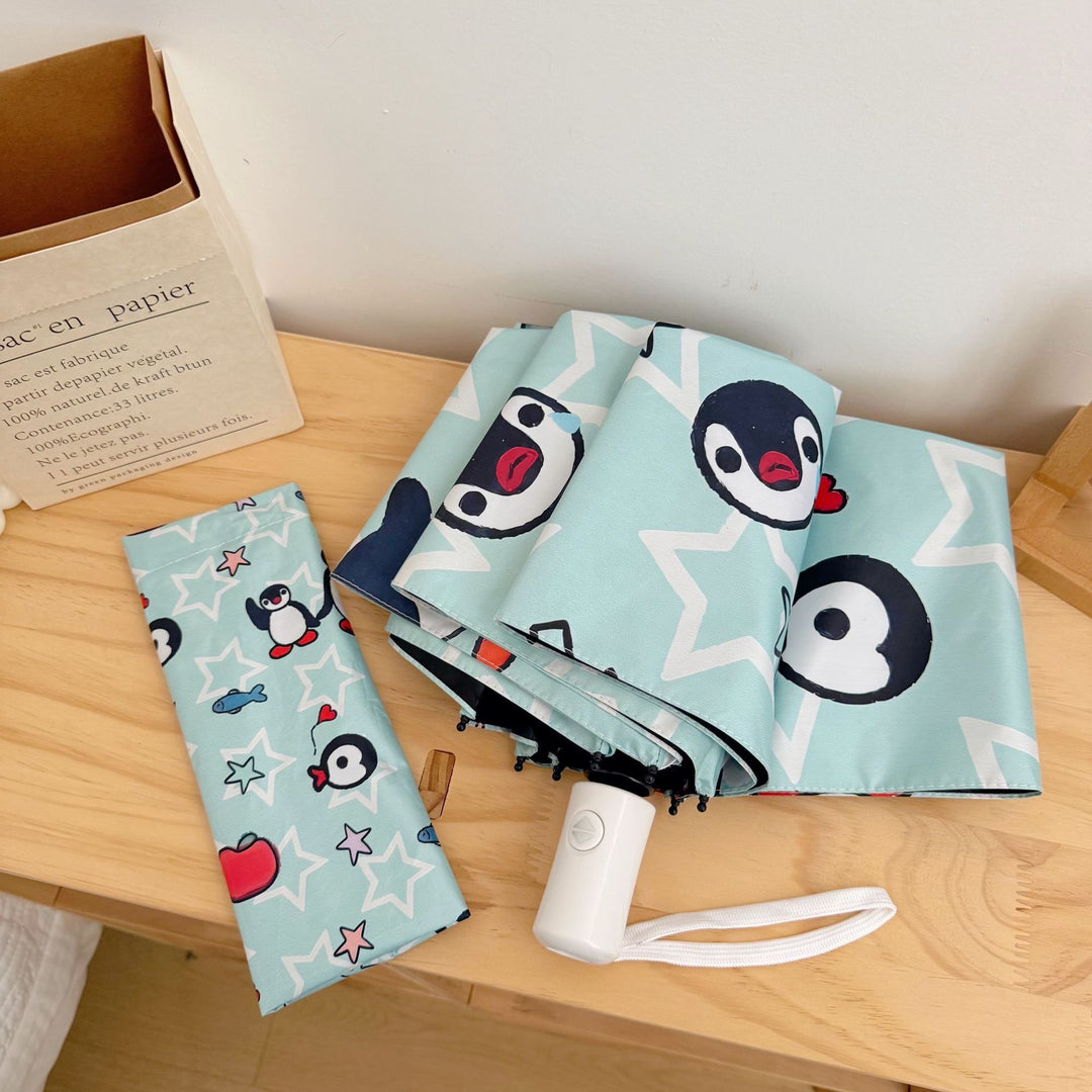 Ladies collapsible umbrella with playful penguin design Bowlift