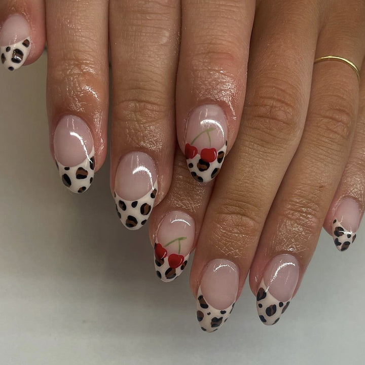 Artful animal pattern nails with cherry accents Bowlift