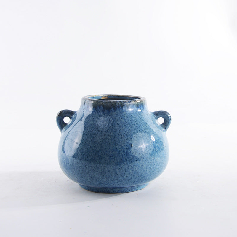 Decorative ceramic pot with playful handles Bowlift