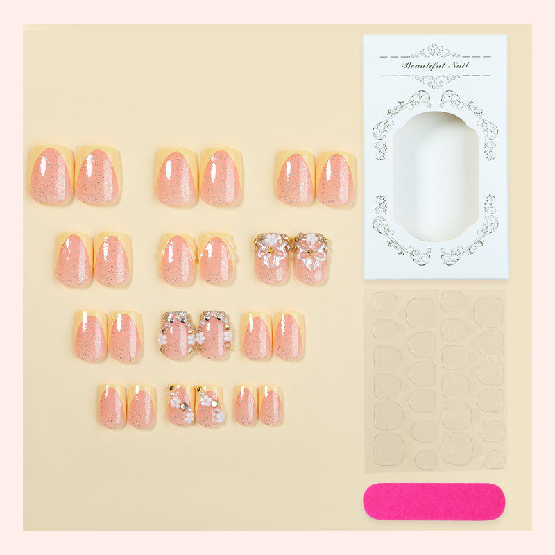 Nail art set with glamorous glitter and flower accents Bowlift