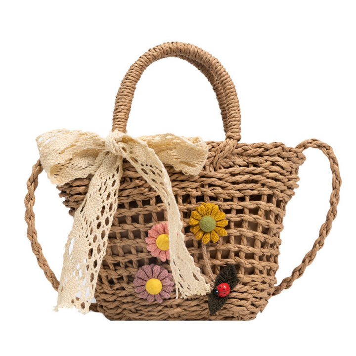 Playful basket bag with floral appliqués Bowlift
