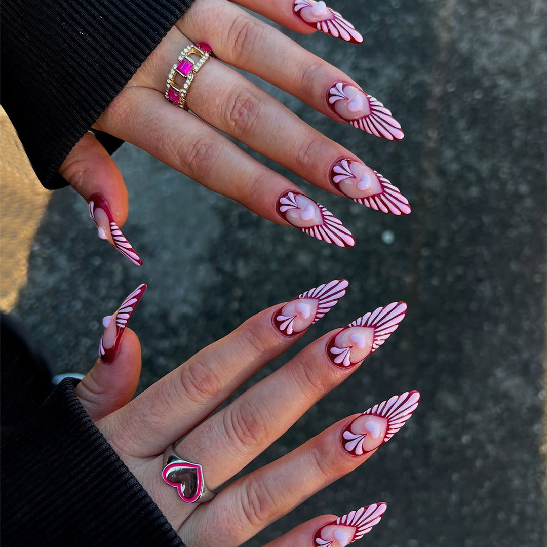 Artificial nails with playful heart design and elegant accents Bowlift