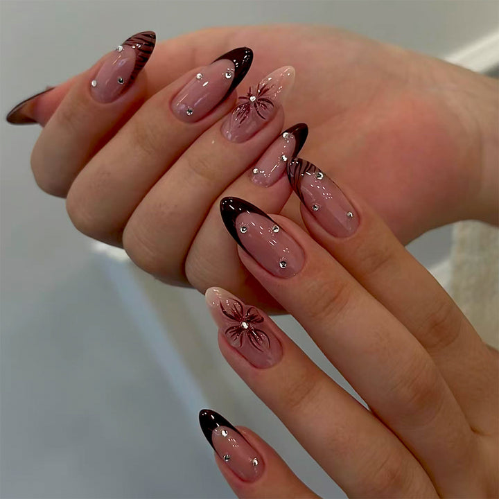 Artificial nails with elegant flower design and glitter accents Bowlift