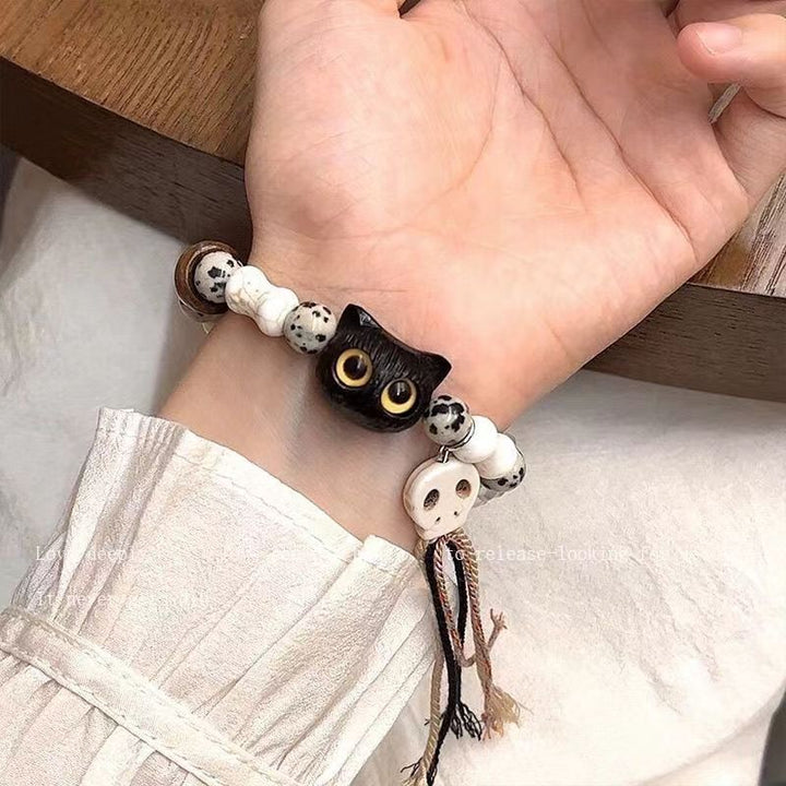 Whimsical Cat and Bone Charm Bracelet Bowlift