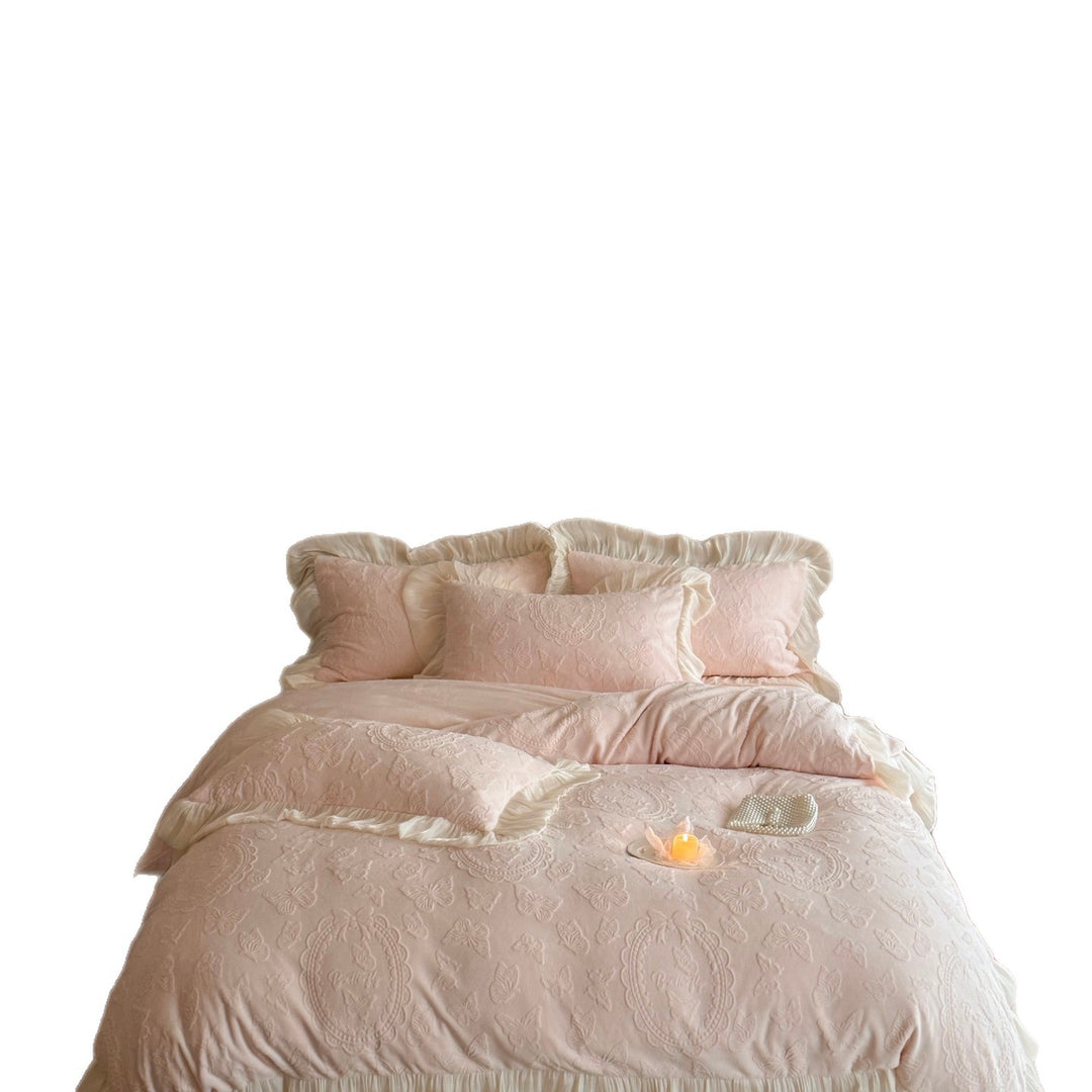 Bedding set with quilted butterfly embossing and romantic ruffle hem