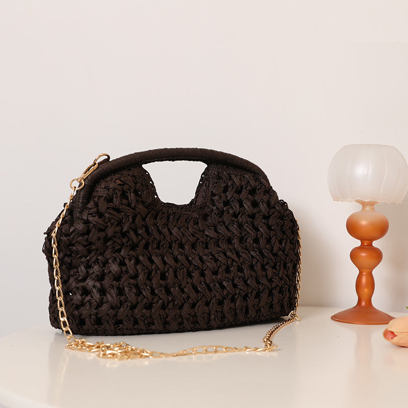 Handcrafted rattan bag with elegant handles and chain straps Bowlift