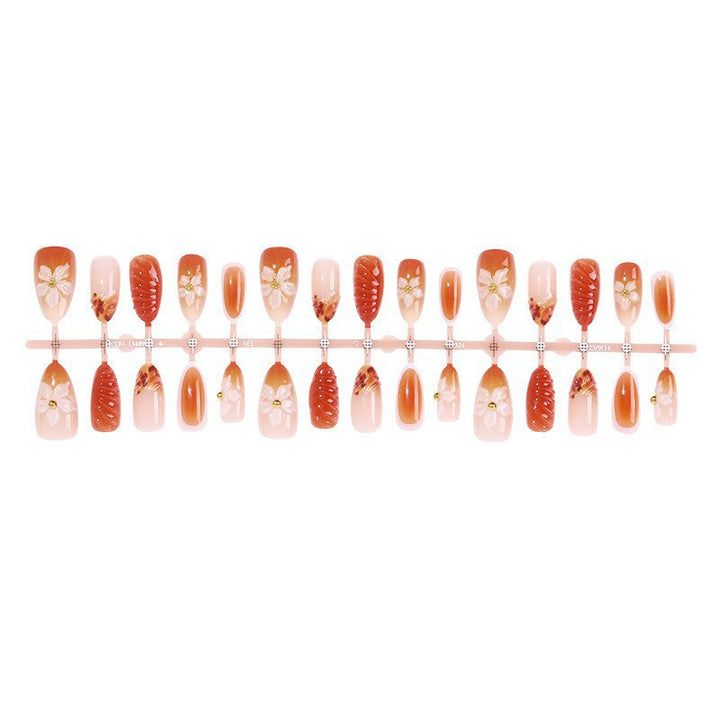 Artificial nail set with handcrafted flowers and elegant embellishments Bowlift